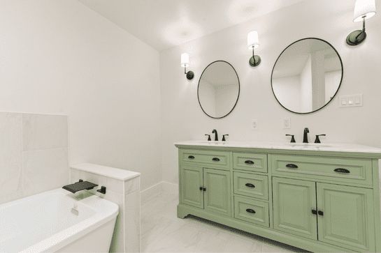 Modern Bathroom remodeler - bathroom with oval mirrors and modern fixtures